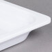 A white Thunder Group full size food pan.