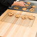 A cookie on a Footed Cooling Rack.