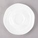 A 10 Strawberry Street bright white porcelain saucer with a small rim.