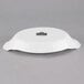 A white porcelain oval rarebit dish with a logo on it.