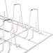 A metal rack with metal rods for 10 birds.