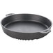 A black round roasting/baking pan with handles.