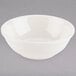 A Tuxton eggshell white china bowl.