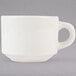 A Tuxton white china cup with a handle.