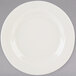 A Tuxton Reno ivory china plate with a wide white rim.