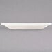 A white oval china platter with a wide rim.