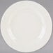 A Tuxton Reno ivory china plate with a wide white rim.