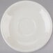 A white Tuxton Reno saucer with a circle on a gray surface.