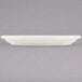 A white Tuxton oval china platter with a black border.