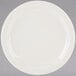 A Tuxton Nevada ivory china plate with a narrow rim on a white background.