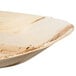 An EcoChoice oval palm leaf salad tray.