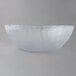 A Carlisle clear polycarbonate bowl with a frosted design on a white background.