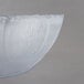 A Carlisle clear polycarbonate bowl with a thin petal rim.