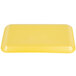 A yellow rectangular CKF foam meat tray with text on it.