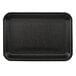 A black CKF foam meat tray on a white counter.