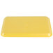 A yellow rectangular CKF foam meat tray with a logo on it.