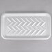 A white styrofoam tray with a chevron pattern on it.