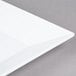 An American Metalcraft white square melamine platter with a white edge.