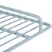 A close-up of an Avantco coated metal wire shelf.