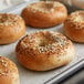 A tray of bagels with Regal Everything Bagel Seasoning on them.