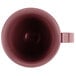 A close up of a Cambro cranberry insulated mug with a handle.