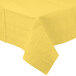 A yellow tablecloth with a white border.