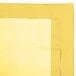 A yellow rectangular table cover with a white border.