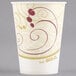 A white Solo paper cold cup with a red and gold swirl design.