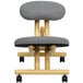 A Flash Furniture grey kneeling office chair with wheels.