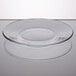 A close-up of a Libbey clear glass salad/dessert plate on a white surface.