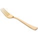 A close up of a Fineline gold plastic fork with a white background.