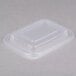 A clear plastic Genpak rectangular lid on a white surface.