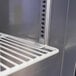 A metal shelf inside a Turbo Air M3 Series undercounter refrigerator.