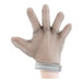 A hand wearing a San Jamar stainless steel mesh glove.