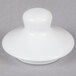 A white round lid with a white knob.