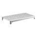 A white plastic grate with holes for a Cambro Camshelving Premium shelf.