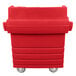 a red plastic bin on wheels