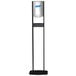 A black and silver Purell hand sanitizer dispenser stand with a rectangular base.