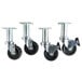 A set of four Pitco swivel casters with black rubber wheels.