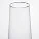 A clear plastic stemless flute with a clear rim.