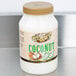 A case of 12 Golden Barrel 32 oz. bottles of coconut oil on a white counter.