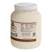 A white container of Golden Barrel Coconut Oil with a white label.