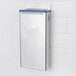An Edlund stainless steel knife rack with blue insert.
