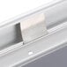 The mitered corners of a white Aarco satin aluminum snap frame.