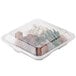 A clear plastic GET 3-compartment reusable container with food inside.