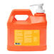 A red rectangular box with four plastic bottles of GOJO Natural Orange hand cleaner. Each bottle has a white pump lid.