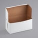 A white box with a brown lid.