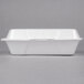 A white Genpak foam container with a hinged lid.