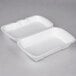 Two white Genpak foam hinged lid containers.