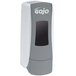 A close-up of a grey and white GOJO® soap dispenser box.